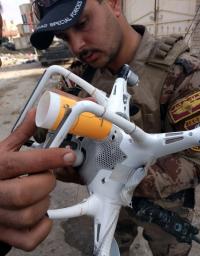 Figure 1: Iraqi Counter Terrorism Forces Examine an ISIS Drone Modified to Drop Small Explosives (Photo Courtesy of Mitch Utterback). 