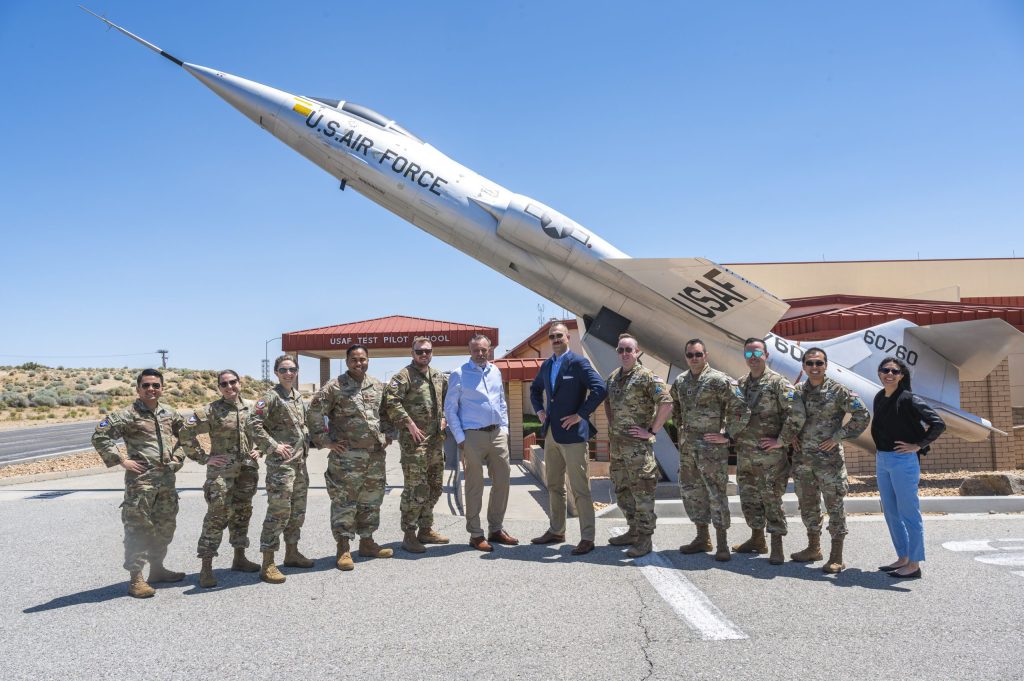 Space Test Course Class 24A at the U.S. Air Force Test Pilot School standing in front of a plane