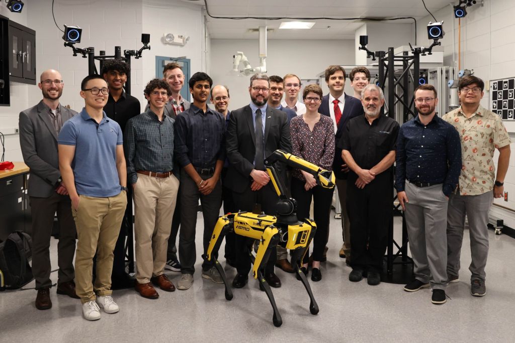 The Air Force Research Laboratory’s Digital Manufacturing Research Team celebrates the official opening of the new Collaborative Automation for Manufacturing Systems Laboratory at Wright-Patterson Air Force Base after a ribbon-cutting ceremony July 23, 2024. This is the team’s first internal laboratory. (U.S. Air Force photo / Sarah Perez)