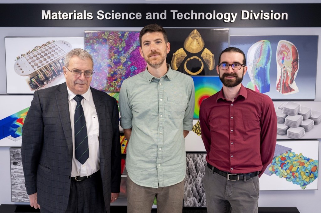 Alexander Efros (left), Ph.D., U.S. Naval Research Laboratory (NRL) senior scientist; John Lyons (center), Ph.D., NRL physical scientist; and Michael Swift, Ph.D., NRL research physicist, gather for a group photo in the Materials Science and Technology facility in Washington, D.C., July 25, 2024. The team performs basic and applied research on functional, structural, and electronic materials systems. (U.S. Navy photo by Sarah Peterson)