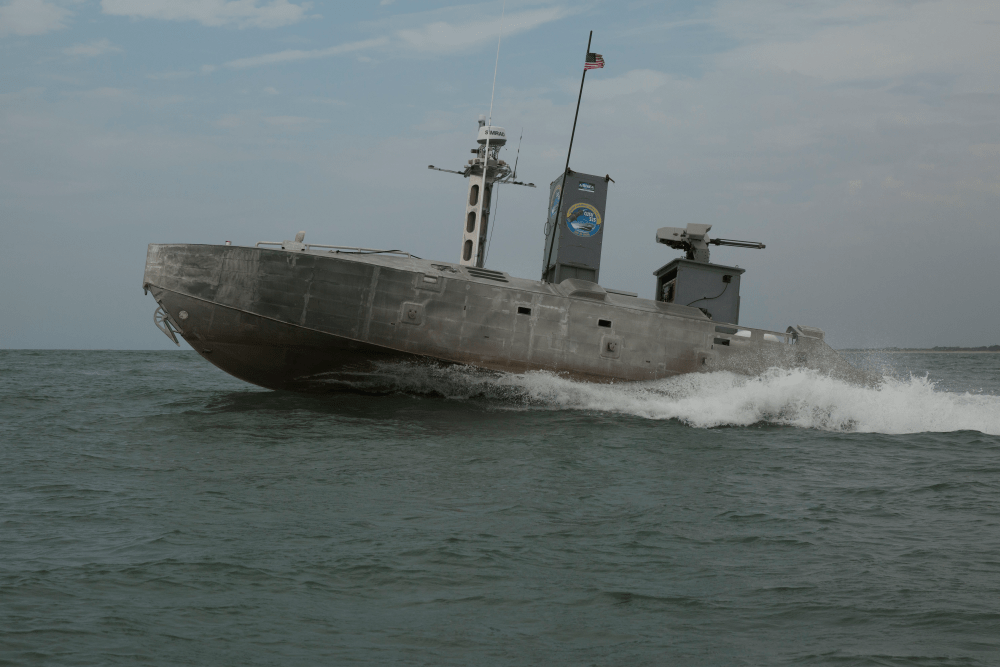 An unmanned surface vessel autonomously navigates a water bound course during a training exercise.