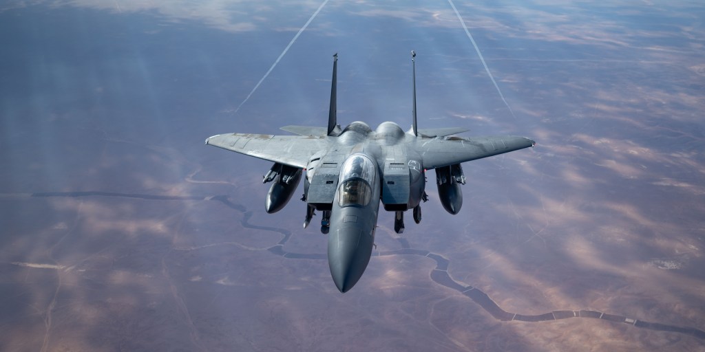 A U.S. Air Force F-15E Strike Eagle flies over the U.S. Central Command area of responsibility