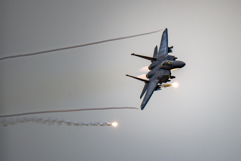 An F-15E launching flares in an exercise.