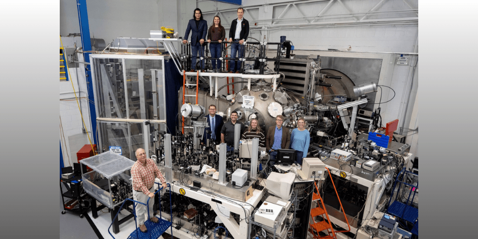 Members of the Laser Plasma Branch at the U.S. Naval Research Laboratory join visitors from fellows defense research agencies for a group photo in the NIKE target area in Washington, D.C., Oct. 25, 2024. The visit featured a tour of the NIKE laser facility to promote potential collaborative experiments in reactive materials research. (U.S. Navy photo by Sarah Peterson)