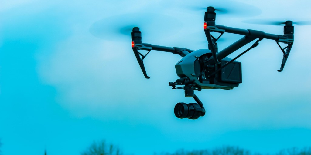 drone with camera attached, in flight