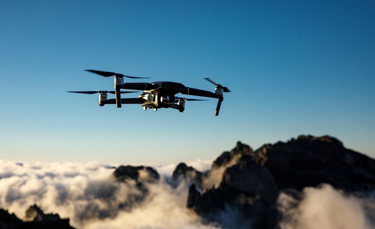 drone flying in the sky at dusk