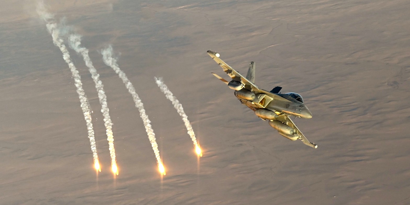A U.S. Navy EA-18G Growler fires flares during an Operation Inherent Resolve mission over the U.S. Central Command area of responsibility, Dec. 24, 2024. The Growlers are part of the USS Harry S. Truman Carrier Strike Group and are deployed in support of maritime security operations and theater security cooperation efforts in the CENTCOM AOR. (U.S. Air Force photo by Staff Sgt. Gerald R. Willis)