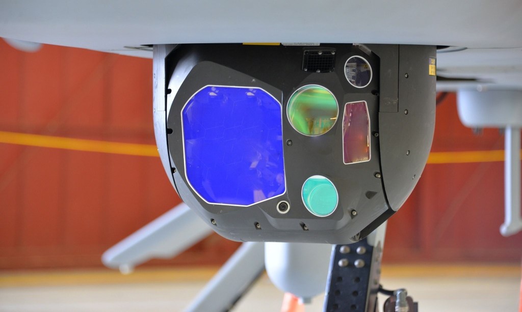 The Common Sensor Payload is the electro-optical/infrared/laser range designator sensor for battlefield commanders onboard the MQ-1C Gray Eagle uncrewed aircraft system. It provides real-time imagery for detection and classification of targets and threats for battlefield commanders with day and night imaging sensors, laser designation, pointing, target marking, and spot tracking for aerial intelligence. (U.S. Army Photo)