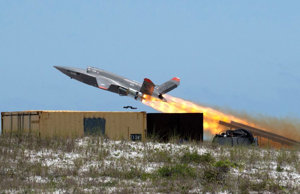 A U.S. Air Force XQ-58A Valkyrie, an autonomous, low-cost tactical unmanned air vehicle, blasts off during a test flight at Eglin Air Force Base. The test flight and data collected will inform future air operations and contribute to advanced autonomous programs. (U.S. Air Force photo by Ilka Cole)