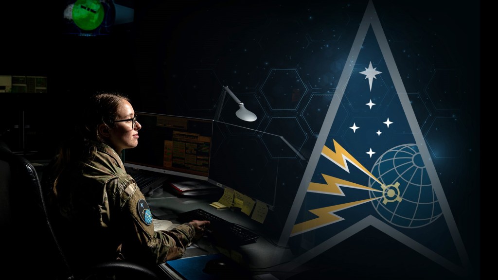 female soldier sitting at a computer