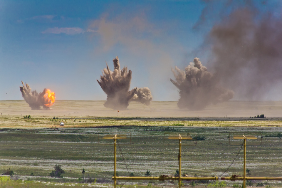 Image of multiple explosions on a range