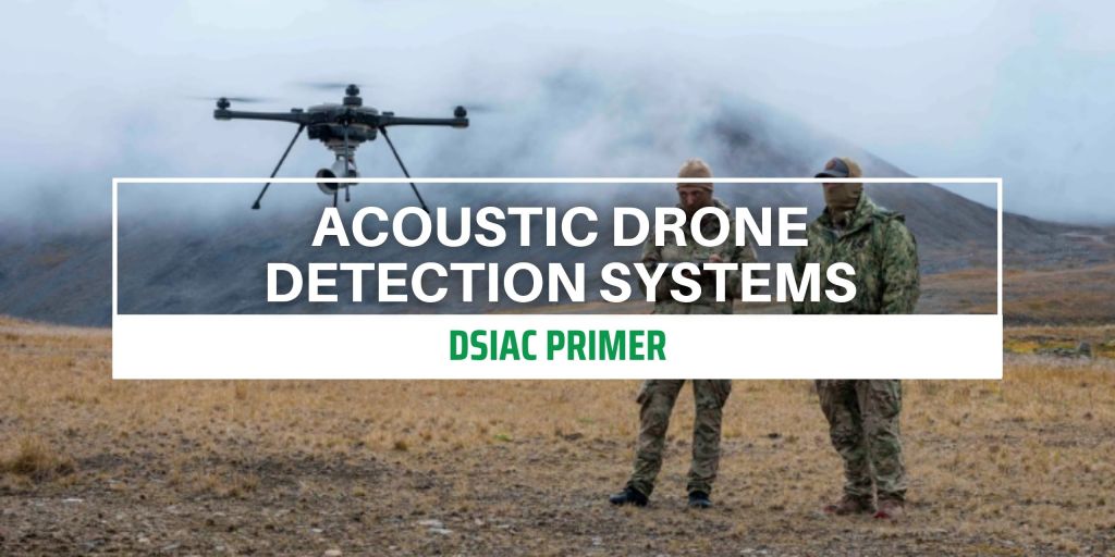 two soldiers standing in a foggy field while operating a drone in flight