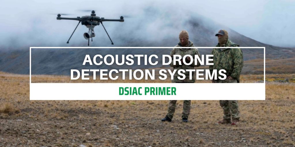 two soldiers standing in a foggy field while operating a drone in flight