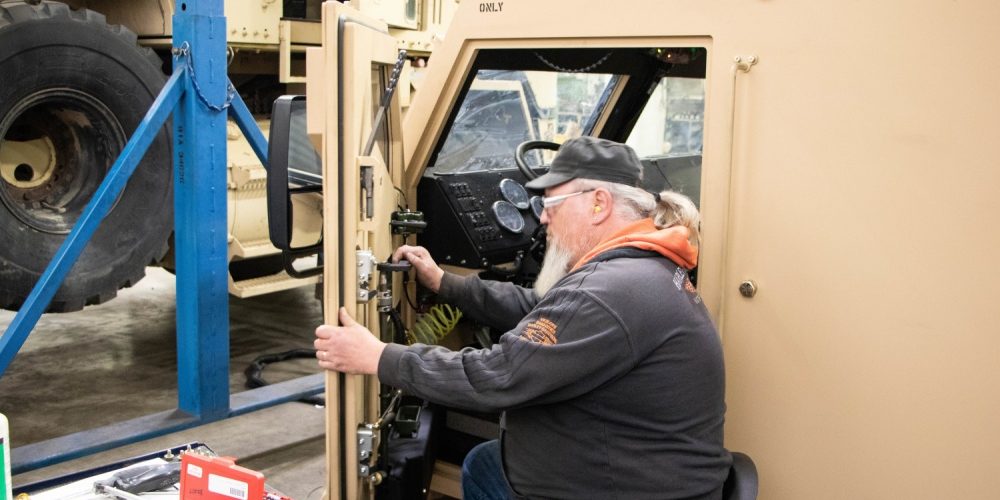 Photo By Debralee Best | Rock Island Arsenal – The HUSK is the replacement cab for the HETS. The new design eliminates the need for add-on kits by having a fully replaceable armored cab, providing greater protection for the Soldier (U.S. Army photo by Debralee Best/RIA-JMTC).