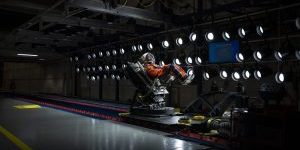 A U.S. Air Force volunteer tests the next replica of a seat and flight suit for the Orion space capsule