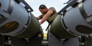 An Airman assigned to the 393rd Bomber Generation Squadron prepares GBU-38 Joint Direct Attack Munitions to be loaded onto a B-2 Spirit stealth bomber at Whiteman Air Force Base, Mo. The loading operations were a component of the Air Force Research Laboratory QUICKSINK Joint Capability Technology Demonstration, a new low-cost, air-delivered capability for defeating maritime threats. (U.S. Air Force photo by Senior Airman Joshua Hastings)