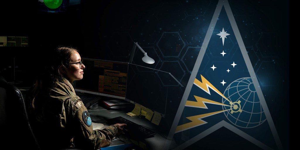 female soldier sitting at a computer