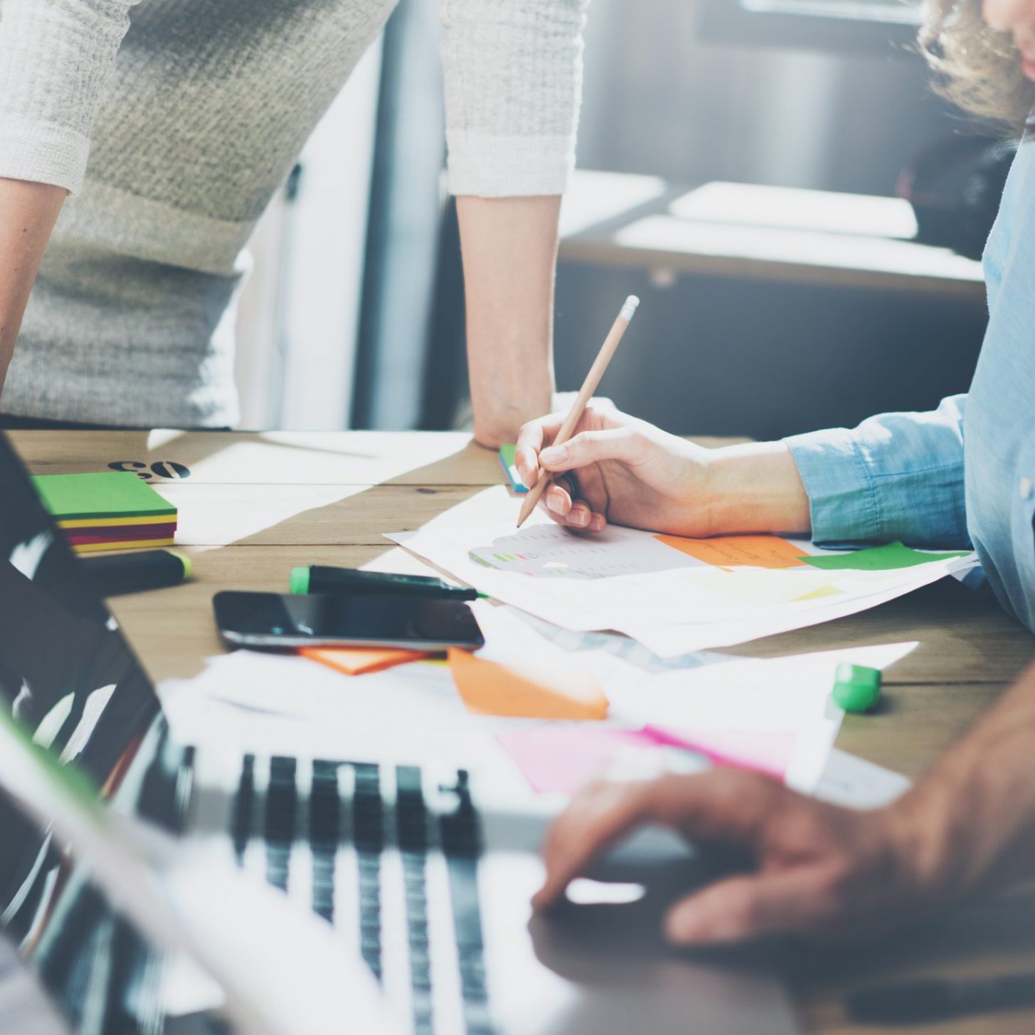 Accounting business meeting concept. Photo young businessman crew working with new startup project in modern loft. Generic design notebook on wood table, talking smartphone. Horizontal, film effect