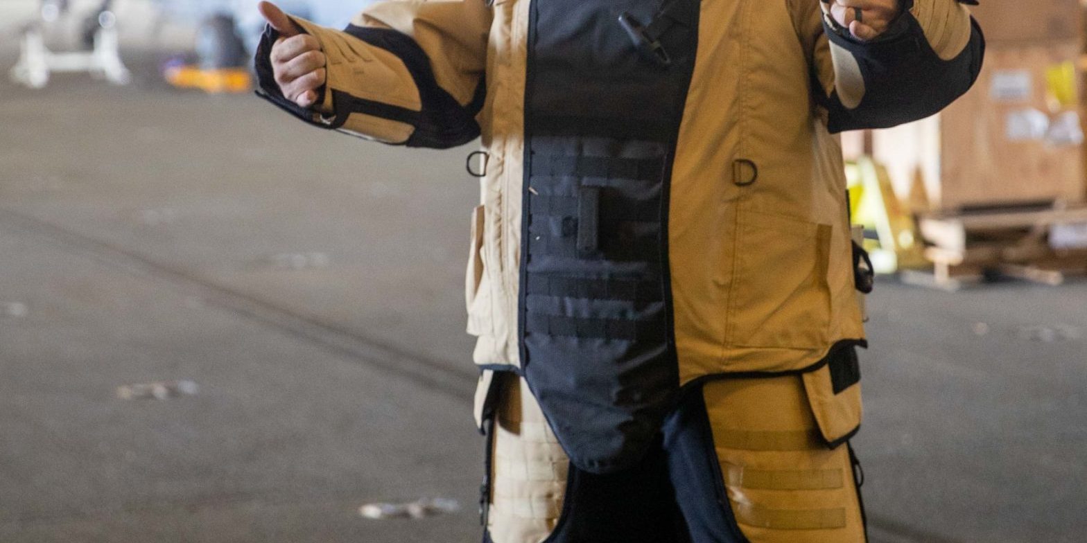 Aviation Boatswain's Mate (Handling) Airman David Douglas, from Myrtle Beach, South Carolina, assigned to the first-in-class aircraft carrier USS Gerald R. Ford’s (CVN 78) air department, wears an explosive device disposal suit, Sept. 21, 2022. Ford is underway in the Atlantic Ocean conducting carrier qualifications and workups for a scheduled deployment this fall. (U.S. Navy photo by Mass Communication Specialist Seaman Apprentice Daniel Perez)