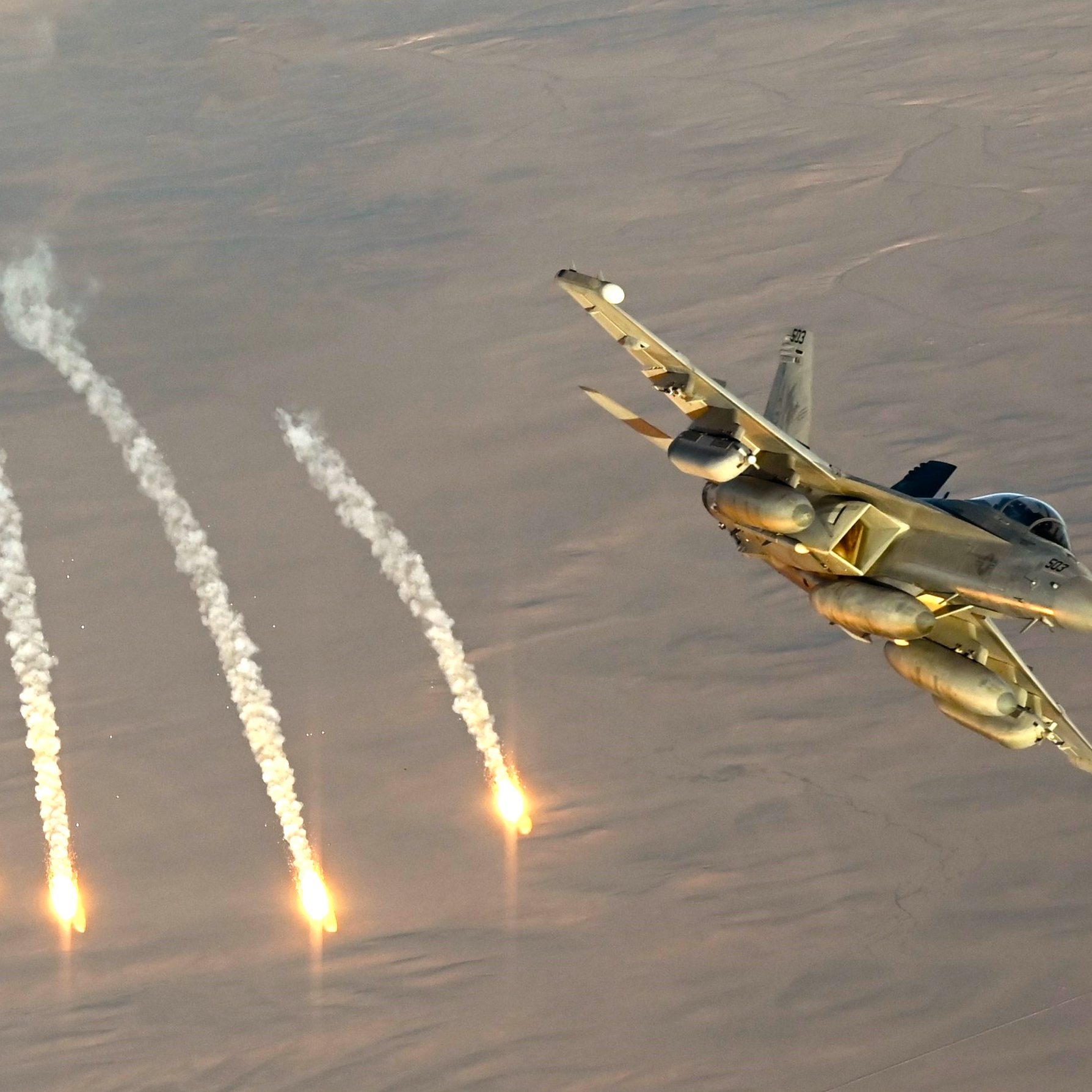 A U.S. Navy EA-18G Growler fires flares during an Operation Inherent Resolve mission over the U.S. Central Command area of responsibility, Dec. 24, 2024. The Growlers are part of the USS Harry S. Truman Carrier Strike Group and are deployed in support of maritime security operations and theater security cooperation efforts in the CENTCOM AOR. (U.S. Air Force photo by Staff Sgt. Gerald R. Willis)