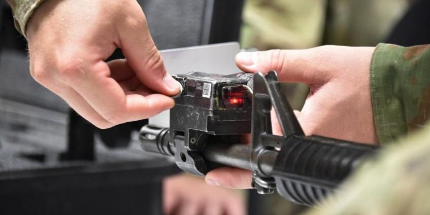 A soldier with 1st Squadron, 91st Cavalry Regiment, 173rd Airborne Brigade, aligns a laser on an M4 rifle during a Multiple Integrated Laser Engagement System Train the Trainer class given by the Training Support Center Grafenwoehr, Training Support Activity Europe at Rose Barracks, Vilseck, Germany (Gertrud Zach/Army).