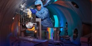 Rick Cross works on the Titan compressor system at the Jupiter Laser Facility. The gratings (rainbow reflection) allow the Titan laser to provide peak power while preserving the optical components of the system. (Photo: Garry McLeod/LLNL)