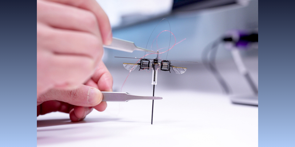 MIT researchers developed a hopping robot that can leap over tall obstacles and jump across slanted or uneven surfaces, while using far less energy than an aerial robot. (Image credit: Melanie Gonick, MIT)