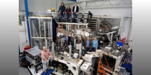 Members of the Laser Plasma Branch at the U.S. Naval Research Laboratory join visitors from fellows defense research agencies for a group photo in the NIKE target area in Washington, D.C., Oct. 25, 2024. The visit featured a tour of the NIKE laser facility to promote potential collaborative experiments in reactive materials research. (U.S. Navy photo by Sarah Peterson)