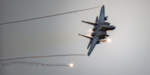 An F-15E launching flares in an exercise.