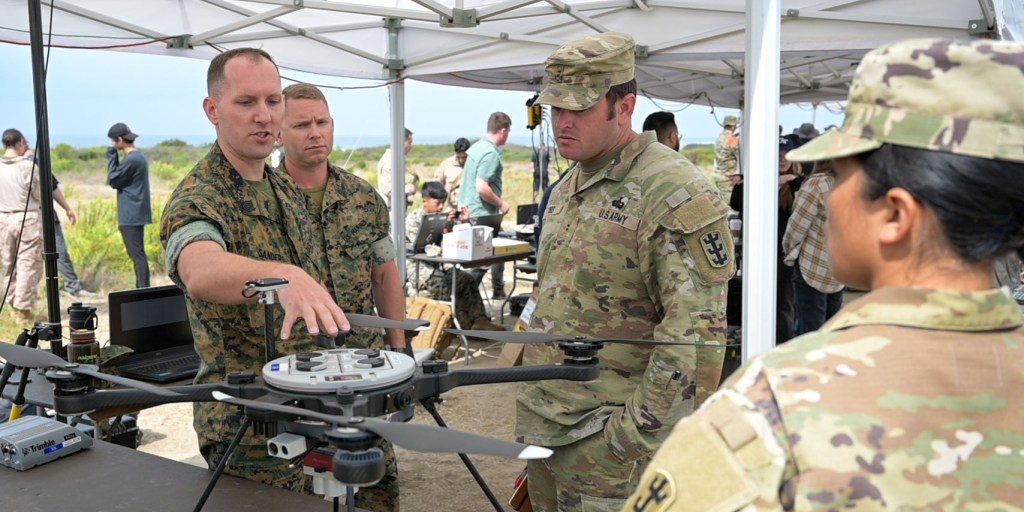 Marines discussing unmanned vehicle