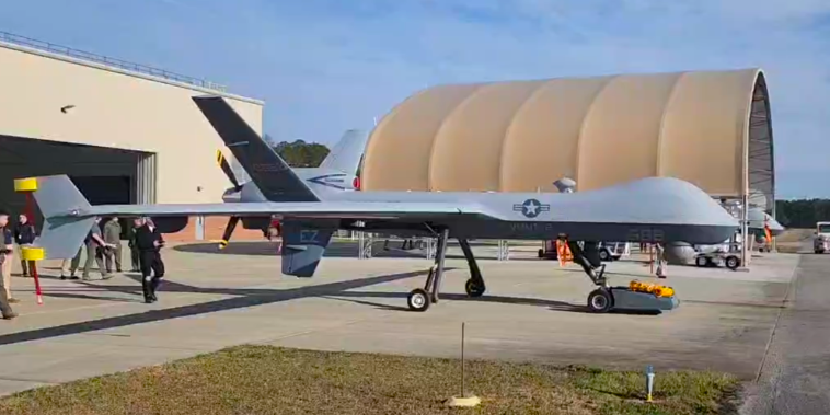 Marines test the TowFLEXX TF-3 Milspec, a new aircraft tug capability, with the MQ-9A Reaper at Marine Corps Air Station Cherry Point in March 2025. The TowFLEXX allows a single operator to maneuver military aircraft with unprecedented precision, maintaining the aircraft's nose wheel alignment while enabling 360-degree turns in confined spaces. (U.S. Navy photo)