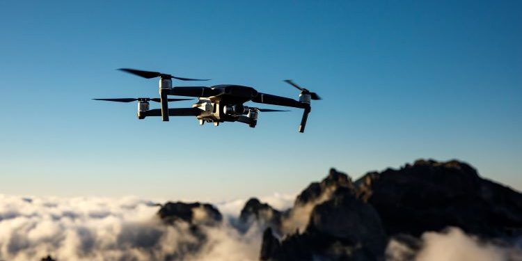 drone flying in the sky at dusk