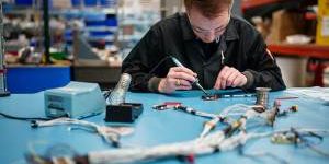 RAPID PROTOTYPING — An electrical engineer works on soldering for Core SkyFox. The project includes the use of commercial off-the-shelf parts and systems for rapid prototyping and testing of hypersonic flight testing. (Photo by Craig Fritz)